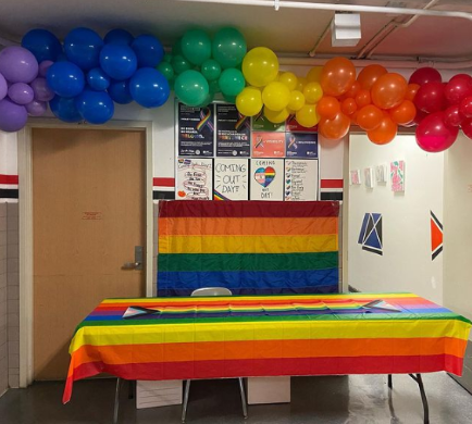 GSA table in hallway on National Coming Out Day. 