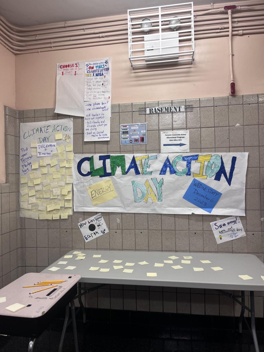 Climate Action Day poster and table outside of the cafeteria. 