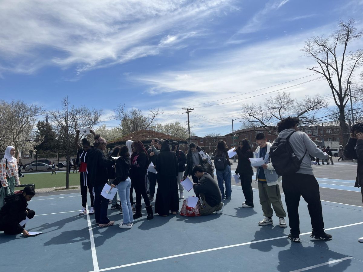 Students using pin-hole cameras. 